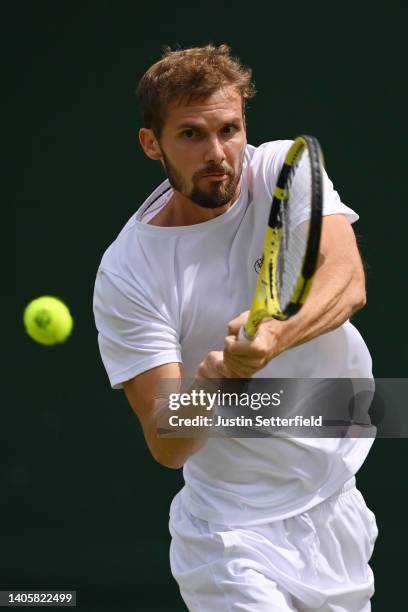 Oscar Otte of Germany plays a backhand against Christian Harrison of United States of America during their Men's Singles Second Round match on day...