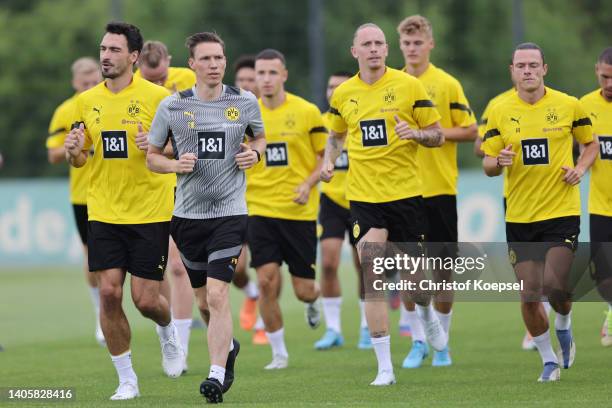 Mats Hummels, Marius Wolf and Nico Schulz attend a training session at training ground Hohenbuschei on June 29, 2022 in Dortmund, Germany. Borussia...