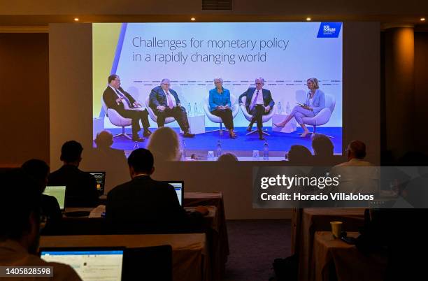 Journalists follow onscreen the Policy Panel with the Governor of the Bank of England Andrew Bailey, the General Manager of Bank for International...