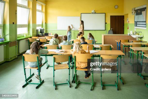 lesson in elemantary school - classroom wide angle stock pictures, royalty-free photos & images