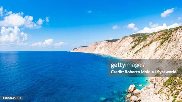 idyllic empty beach by the turquoise sea, greece - ionian islands stock pictures, royalty-free photos & images