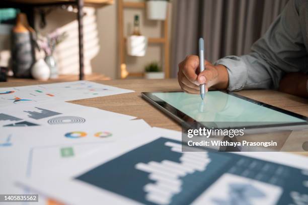 creative female executives using digital tablet in office - portfolio foto e immagini stock