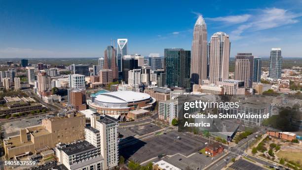 Aerial View of Charlotte, North Carolina on clear day showing highways and skyline.