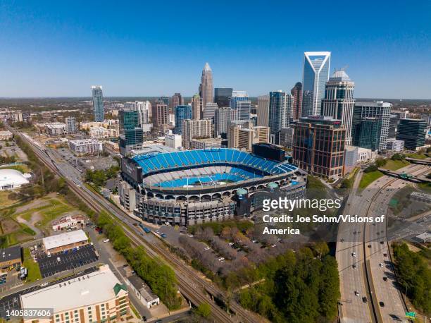 Aerial View of Charlotte, North Carolina on clear day showing highways and skyline and Bank of America Stadium.
