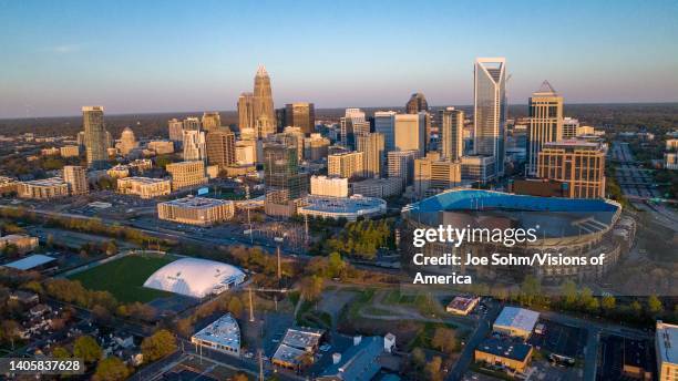 Aerial View of Charlotte, North Carolina on clear day showing highways and skyline and Bank of America Stadium.