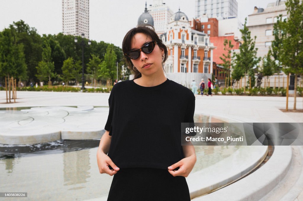 Young woman portrait showing black t-shirt