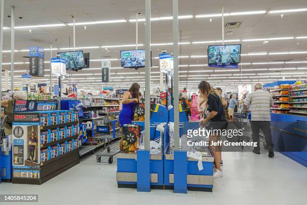 Miami, Florida, Walmart, shoppers in checkout line.