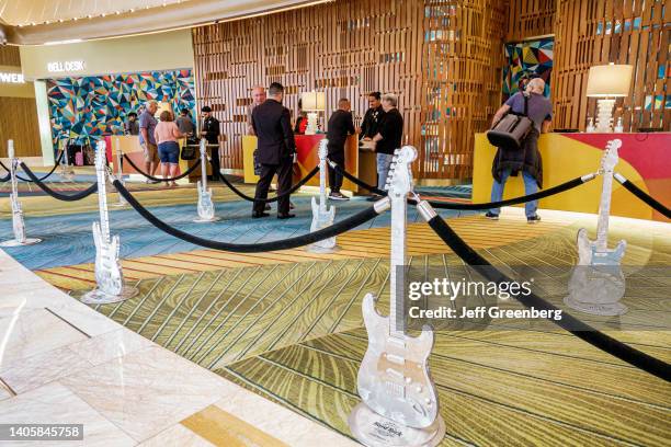 Hollywood, Florida, Seminole Tribe, Hard Rock Hotel & Casino, lobby front reception desk with guests checking in.