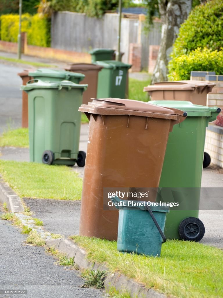 Garbage bins out for collection in Radley Village, Abingdon, England