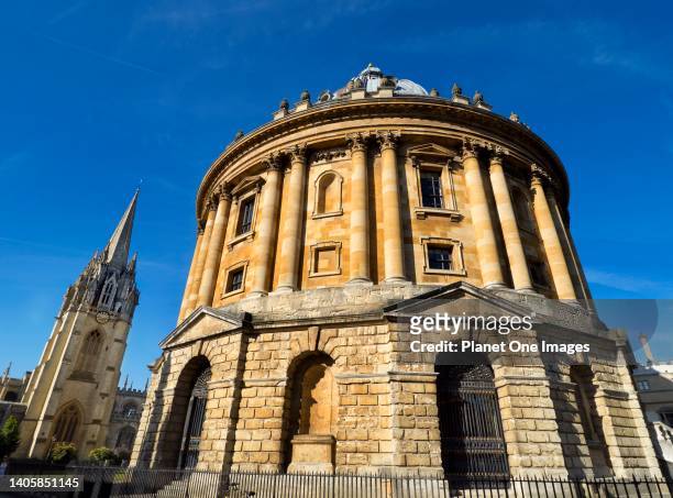 The Radcliffe Camera and St Mary's Church, Oxford, early summer morning.