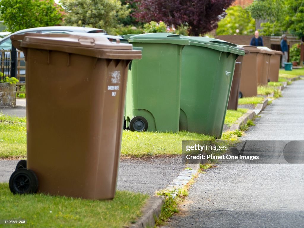 Garbage bins out for collection in Radley Village, Abingdon, England