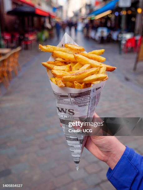 Bag of Belgian fries or frites in Brussels, Belgium.