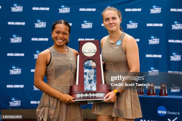 Mae Canete and Adel-Byanu Abidullina of Central Oklahoma Bronchos holds the national runner-up trophy after the Division II Women"u2019s Tennis...