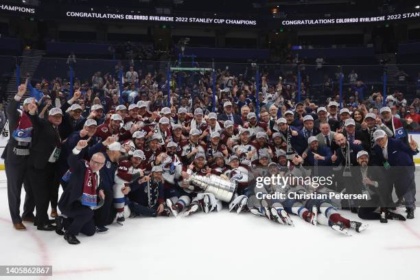 The Colorado Avalanche pose with the Stanley Cup after winning Game Six of the 2022 NHL Stanley Cup Final at Amalie Arena on June 26, 2022 in Tampa,...