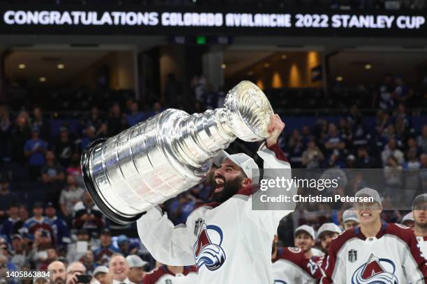Nazem Kadri of the Colorado Avalanche lifts the Stanley Cup in celebration after Game Six of the 2022 NHL Stanley Cup Final at Amalie Arena on June...