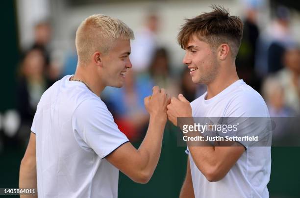 Felix Gill and partner Arthur Fery of Great Britain interact during their Men's Doubles First Round match against Ariel Behar of Uruguay and Gonzalo...