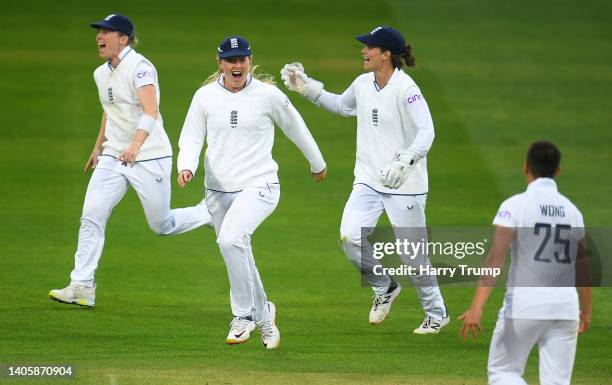 Issy Wong of England celebrates the wicket of Laura Wolvaardt of South Africa with team mate Sophie Ecclestone during Day Three of the First Test...