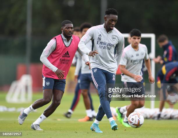 Ainsley Maitland-Niles and Flo Balogun of Arsenal during a training session at London Colney on June 29, 2022 in St Albans, England.