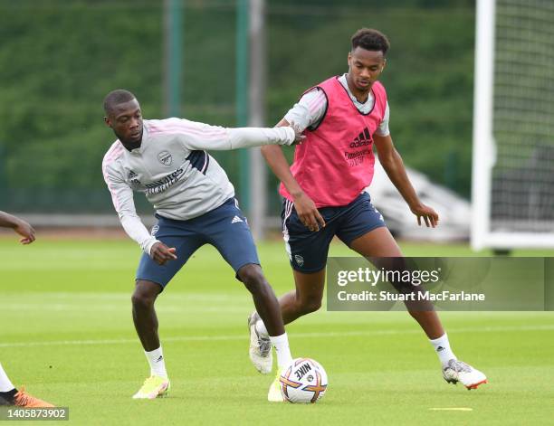 Nicolas Pepe and Zach Awe of Arsenal during a training session at London Colney on June 29, 2022 in St Albans, England.