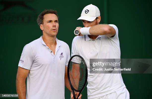 Jamie Murray of Great Britain interacts with partner Bruno Soares of Brazil against Benjamin Bonzi of France and Arthur Rinderknech of France during...