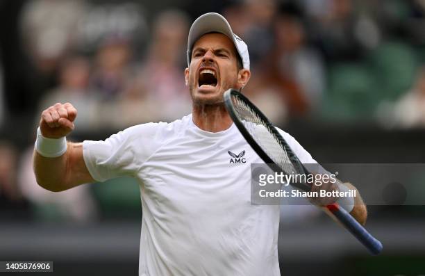 Andy Murray of Great Britain celebrates winning the third set against John Isner of United States of America during their Men's Singles Second Round...