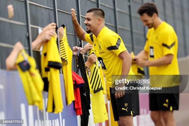 Lion Semic of Dortmund does a selfie with fans after a training session at training ground Hohenbuschei on June 29, 2022 in Dortmund, Germany....