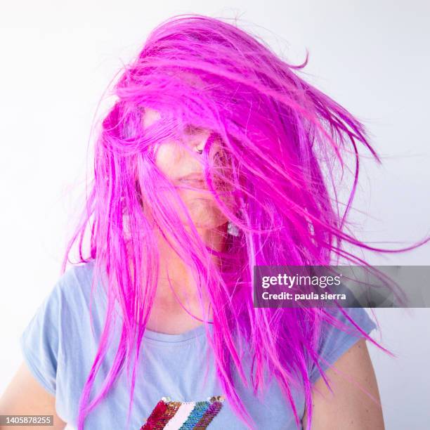 woman wearing pink wig - pink hair stock pictures, royalty-free photos & images