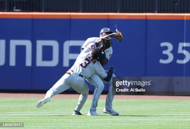 Jeremy Pena crashes into Yordan Alvarez of the Houston Astros while making a catch hit by Dominic Smith of the New York Mets in the eighth inning...