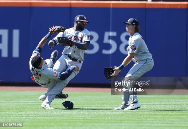 Jeremy Pena crashes into Yordan Alvarez of the Houston Astros while making a catch hit by Dominic Smith of the New York Mets in the eighth inning as...