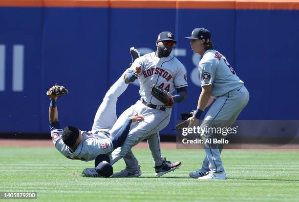 Jeremy Pena crashes into Yordan Alvarez of the Houston Astros while making a catch hit by Dominic Smith of the New York Mets in the eighth inning as...