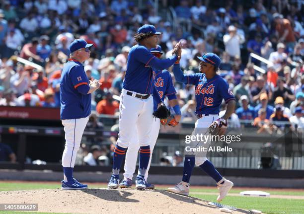 Taijuan Walker of the New York Mets is met by Francisco Lindor of the New York Mets as he leaves the game in the seventh inning againstthe Houston...