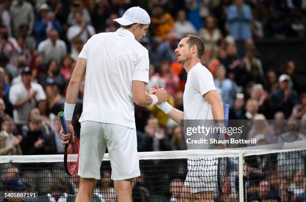 John Isner of The United States interacts with Andy Murray of Great Britain after winning their Men's Singles Second Round match on day three of The...