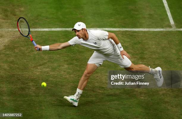 Andy Murray of Great Britain is beaten by an ace against John Isner of the United States during their Men's Singles Second Round match on day three...