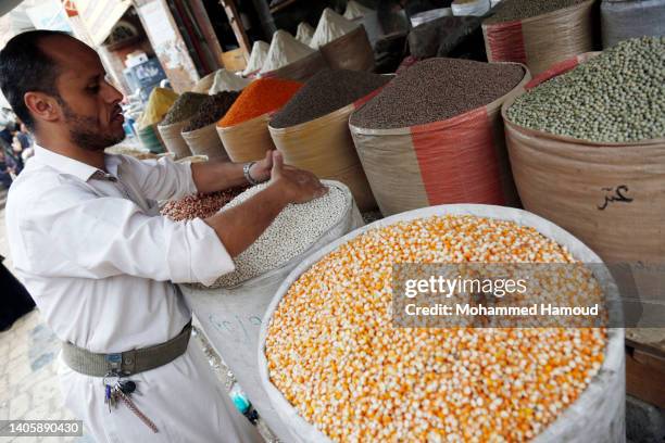 Yemenis shop for wheat at a market on June 29, 2022 in Sana'a, Yemen. In some countries of the Middle East region, like Yemen and Lebanon as a result...