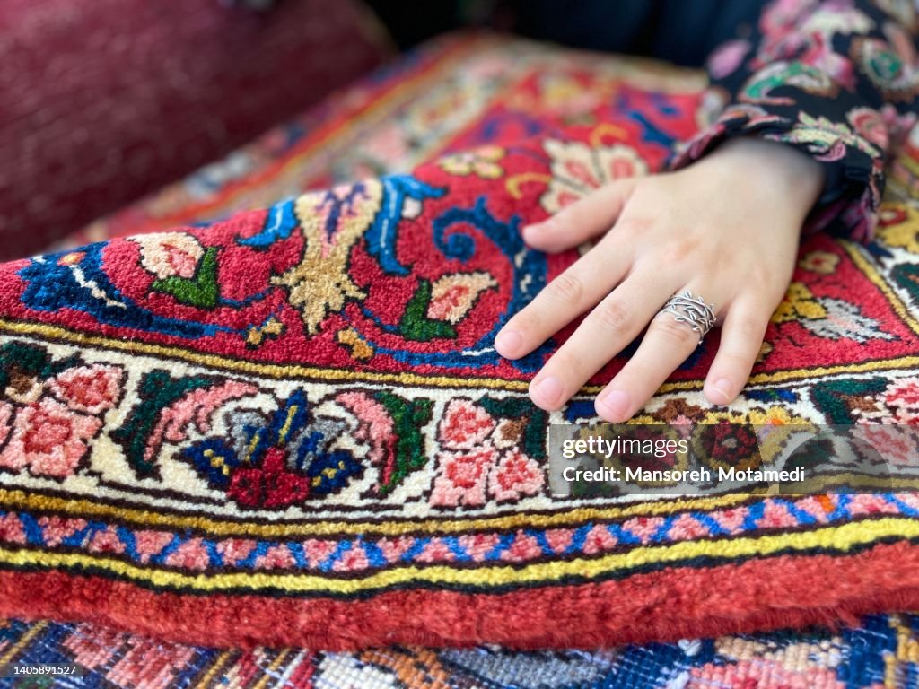 Touching beautiful Iranian carpet