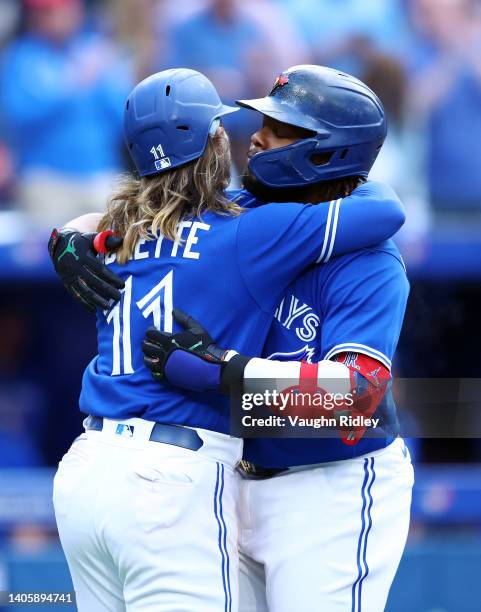 Vladimir Guerrero Jr. #27 of the Toronto Blue Jays celebrates with Bo Bichette after hitting a two run home run in the third inning during a MLB game...