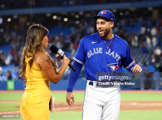 George Springer of the Toronto Blue Jays speaks to Hazel Mae of Sportsnet following a MLB game against the Boston Red Sox at Rogers Centre on June...