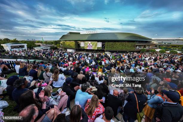 The crowd on The Hill watch the Men's Singles Second Round Match between John Isner of The United States and Andy Murray of Great Britain on the big...