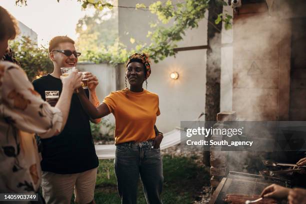 friends having a barbecue - smoking meat stock pictures, royalty-free photos & images