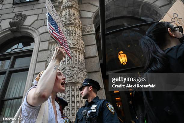 Abortion rights activists protest outside a Federalist Society event featuring former U.S. Attorney General William P. Barr at the University Club on...