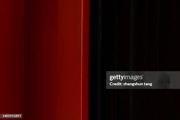 abstract wall with red and black plane shaped stacking under lights. - cool wallpapers stock pictures, royalty-free photos & images