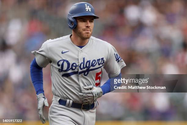 Freddie Freeman of the Los Angeles Dodgers circles the bases after hitting a solo home run against the Colorado Rockies in the first inning at Coors...