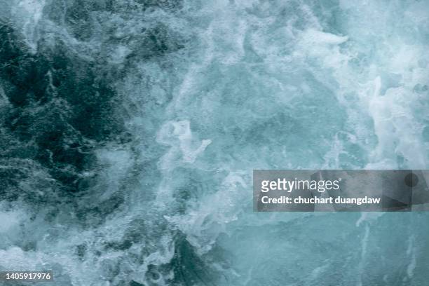 close-up of wave in sea against sky - perfect storm stock pictures, royalty-free photos & images