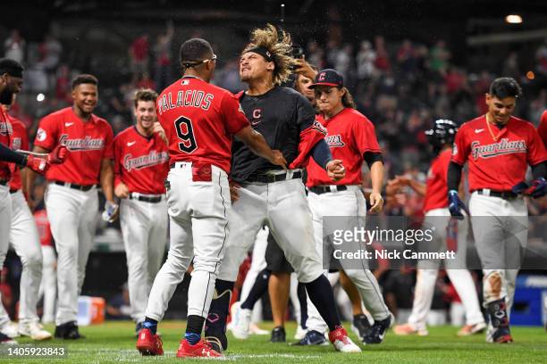 Josh Naylor of the Cleveland Guardians celebrates with Richie Palacios after hitting a walk-off two-run home run during the tenth inning to defeat...
