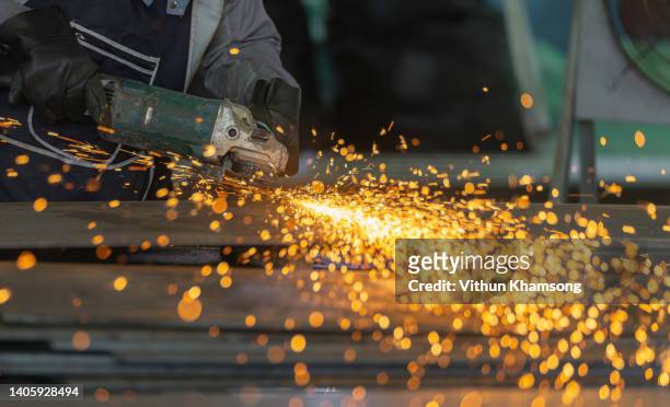 technician cutting for steel structure at manufacture workshop. - herramienta eléctrica fotografías e imágenes de stock