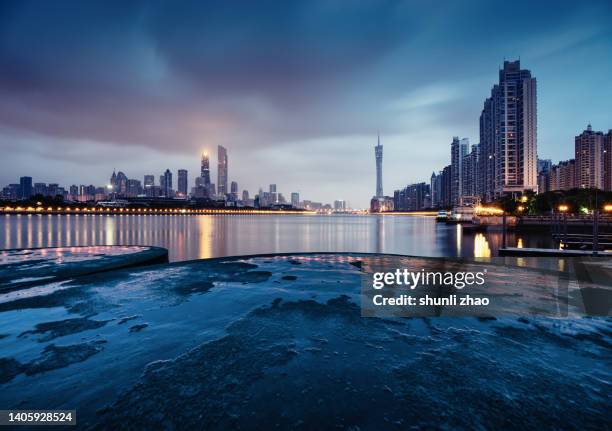 empty road by the river at night - ocean surface level stock pictures, royalty-free photos & images