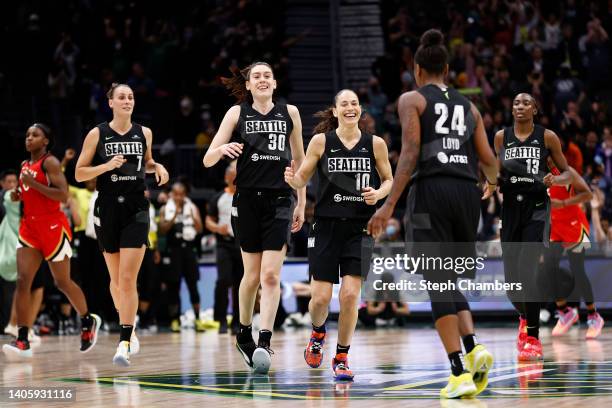 Stephanie Talbot, Breanna Stewart, Sue Bird and Ezi Magbegor of the Seattle Storm celebrate a three point basket by Jewell Loyd during the fourth...