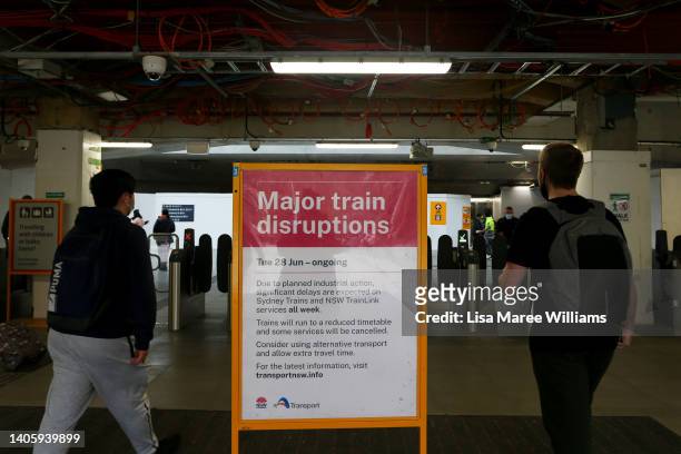 Sign indicating major train disruptions stand as commuters make their way through Central Station on June 30, 2022 in Sydney, Australia. Sydney...