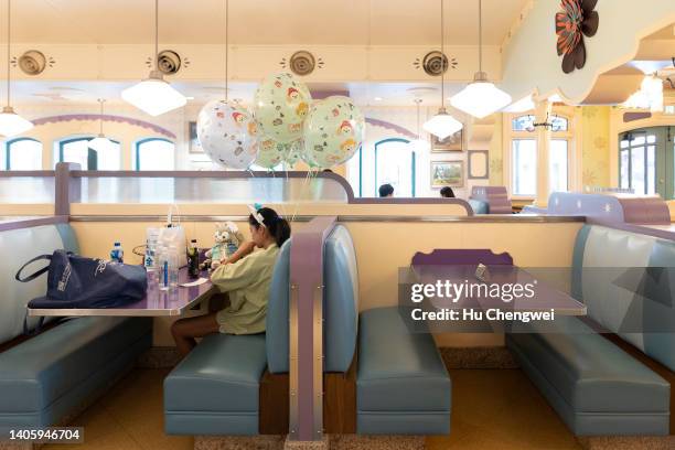 People dine in a restaurant at Shanghai Disneyland on June 30, 2022 in Shanghai, China. Shanghai's Disneyland theme park is reopening today to...