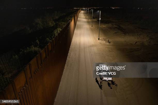 Two drug smugglers are arrested by U.S. Border Patrol agents after crossing the border from Mexico in the early morning hours on June 22, 2022 in...